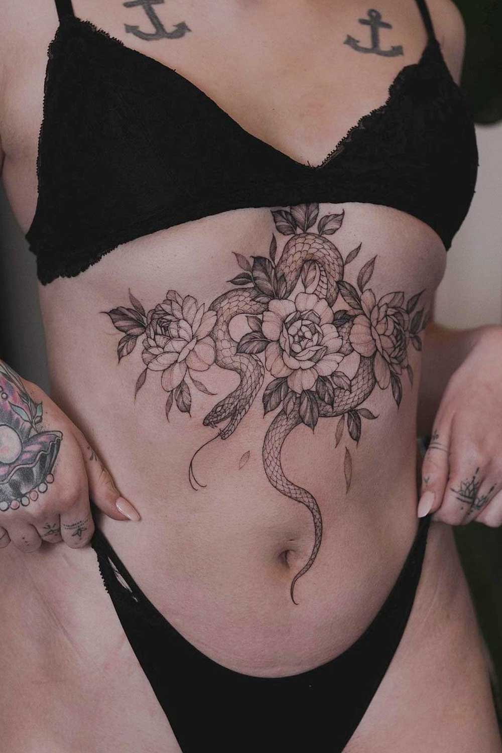 Big Sternum Tattoo of Snake with Flowers