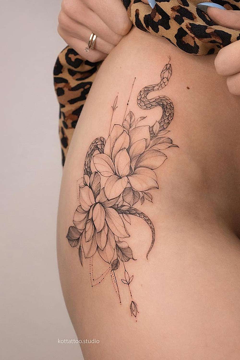 Snake with Flowers Thigh Tattoo
