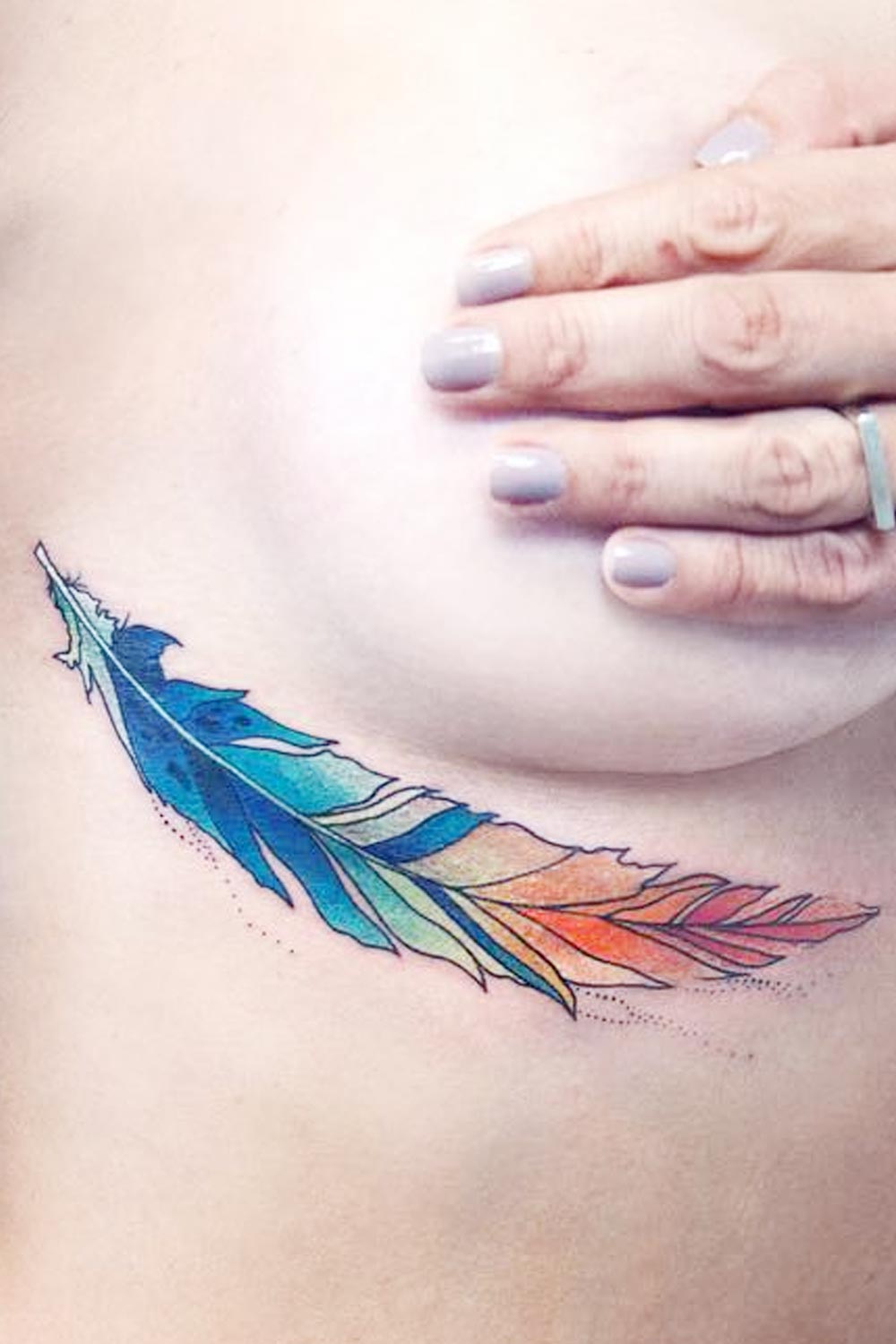 Underbreast Watercolor Feather Tattoo
