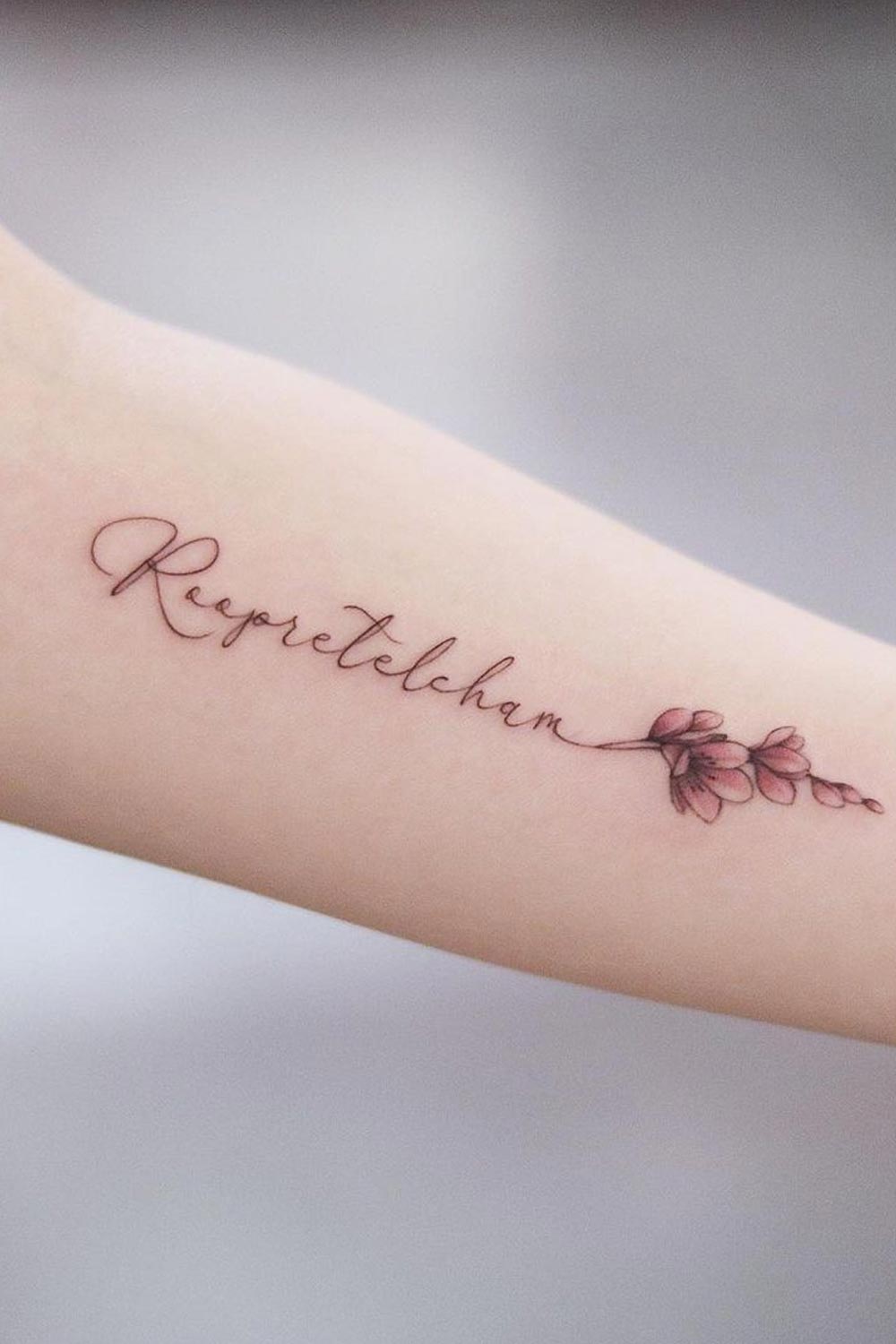 Lettering With Flowers Tattoo