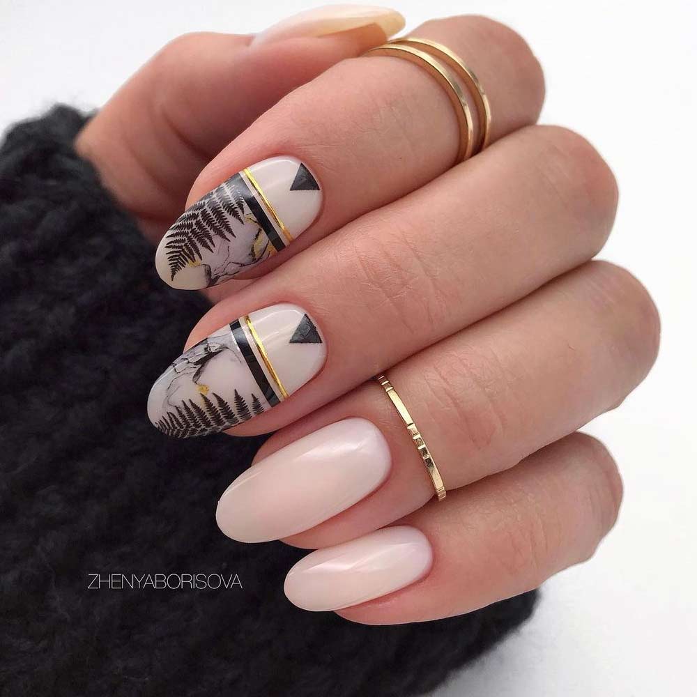 White Nude Oval Nails with Black Floral Accent