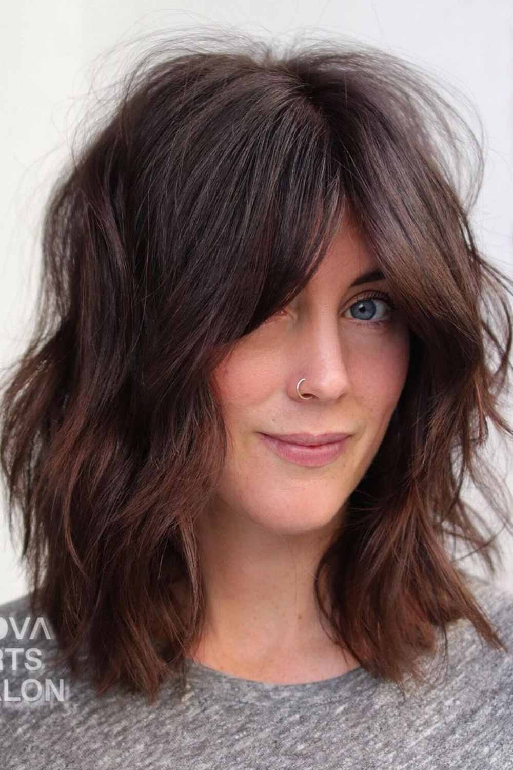 step cut hairstyle for medium wavy hair