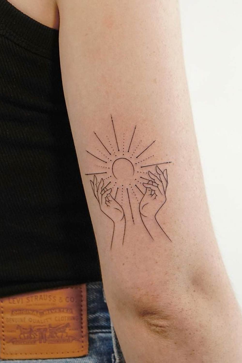 The Sun with Hands Tattoo