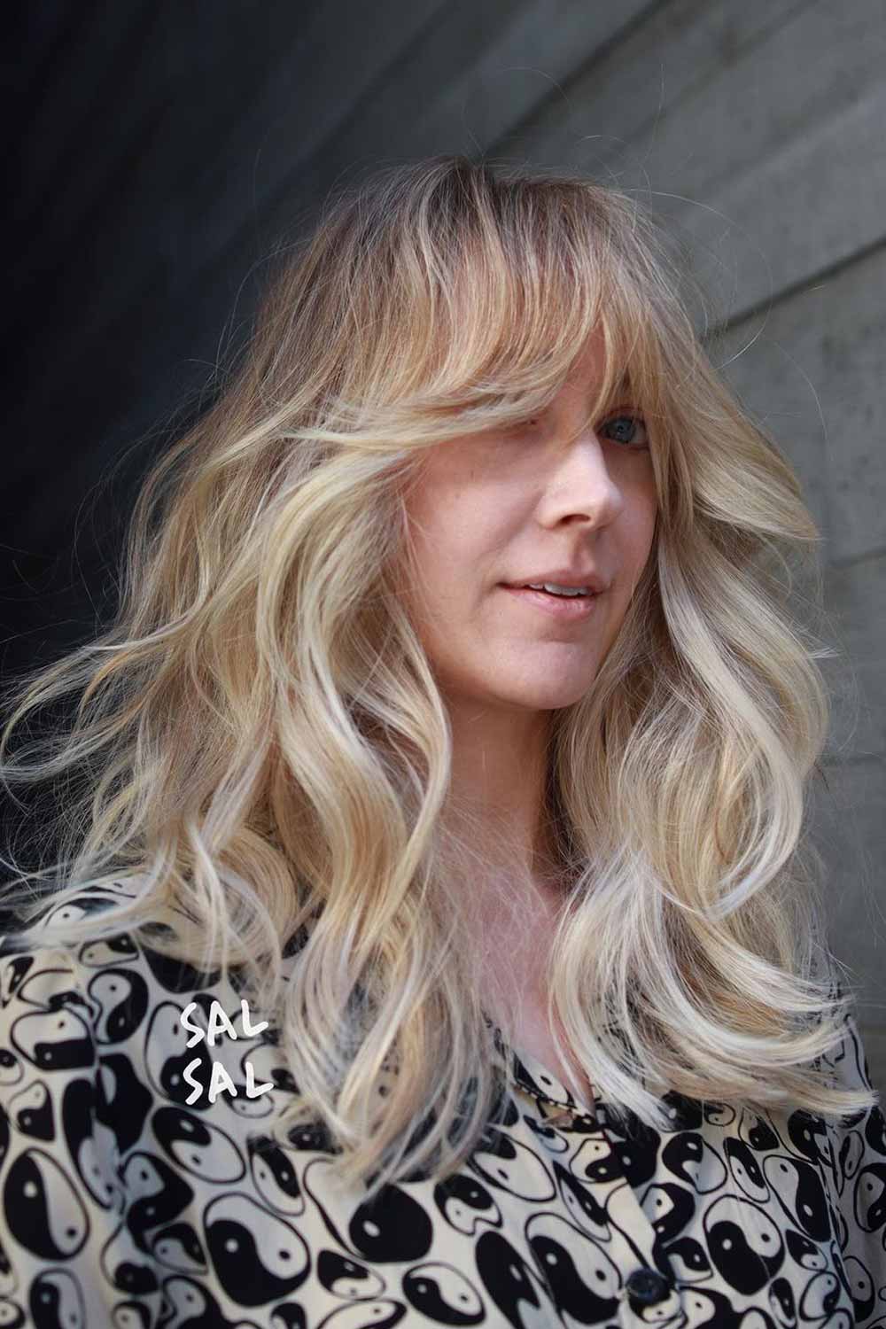 Voluminous Butterfly Haircut with Curtain Bangs