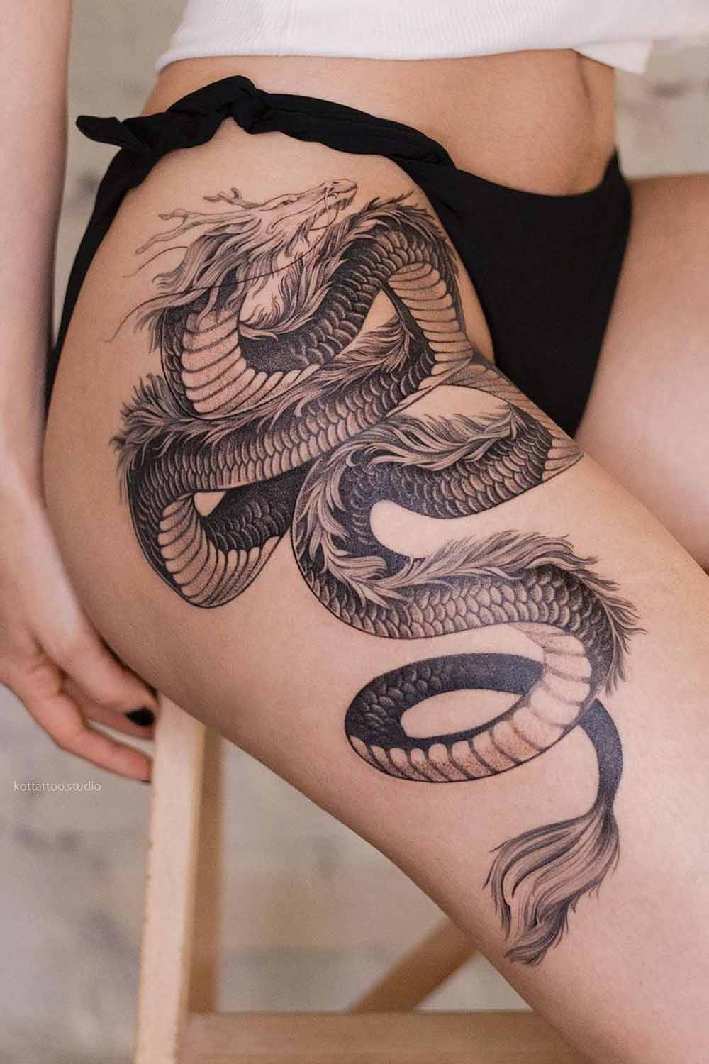 Beautiful Thigh Tattoo with a Dragon
