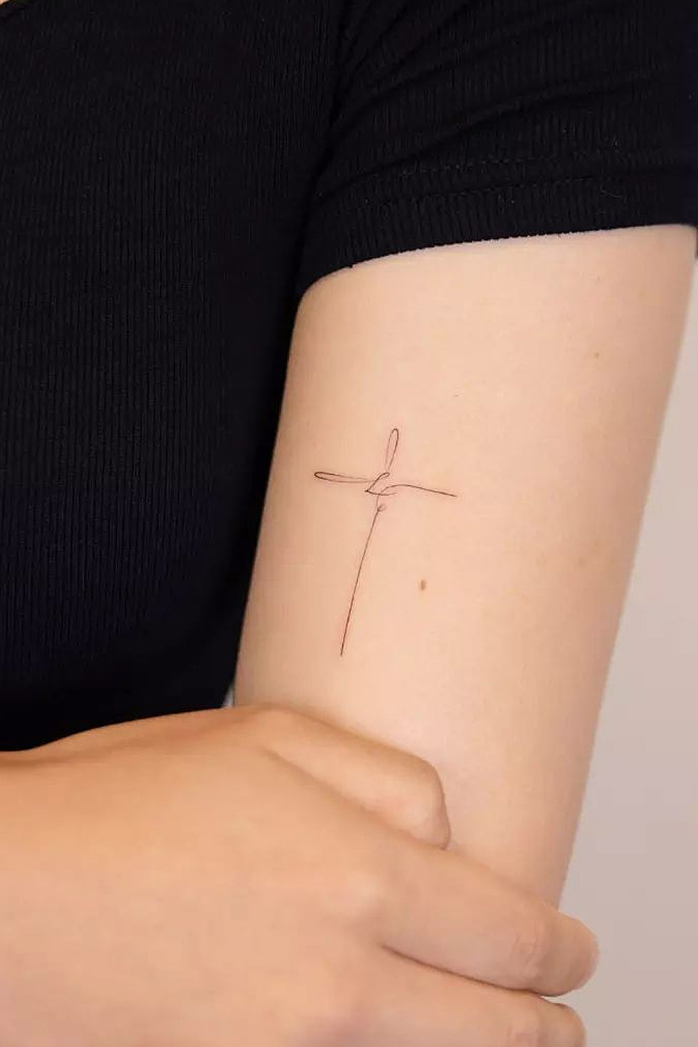 Minimalist Cross Tattoo