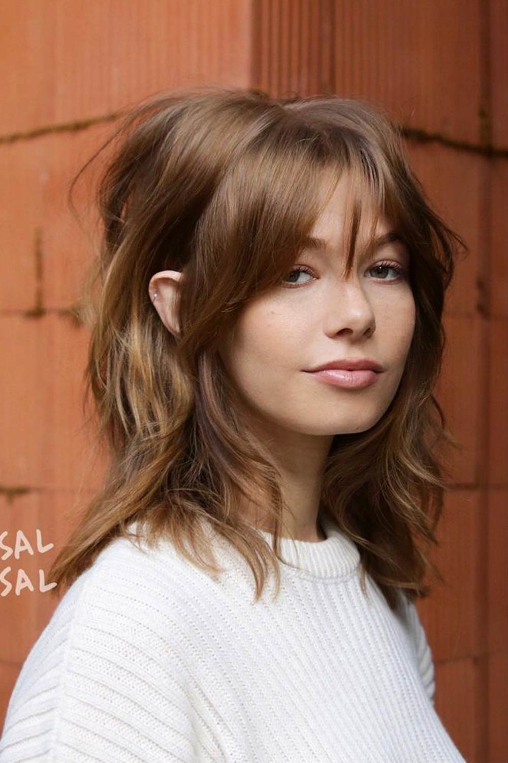 Your Complete Guide to Getting Bangs With Curly Hair