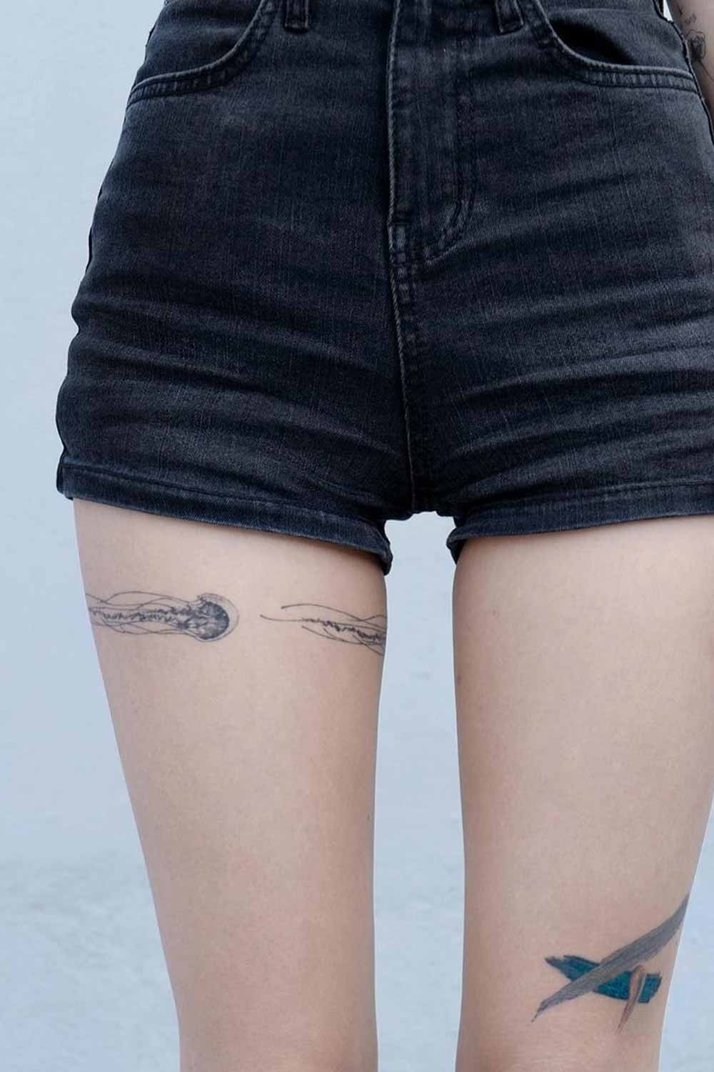 Minimalist Jellyfish Thigh Tattoo
