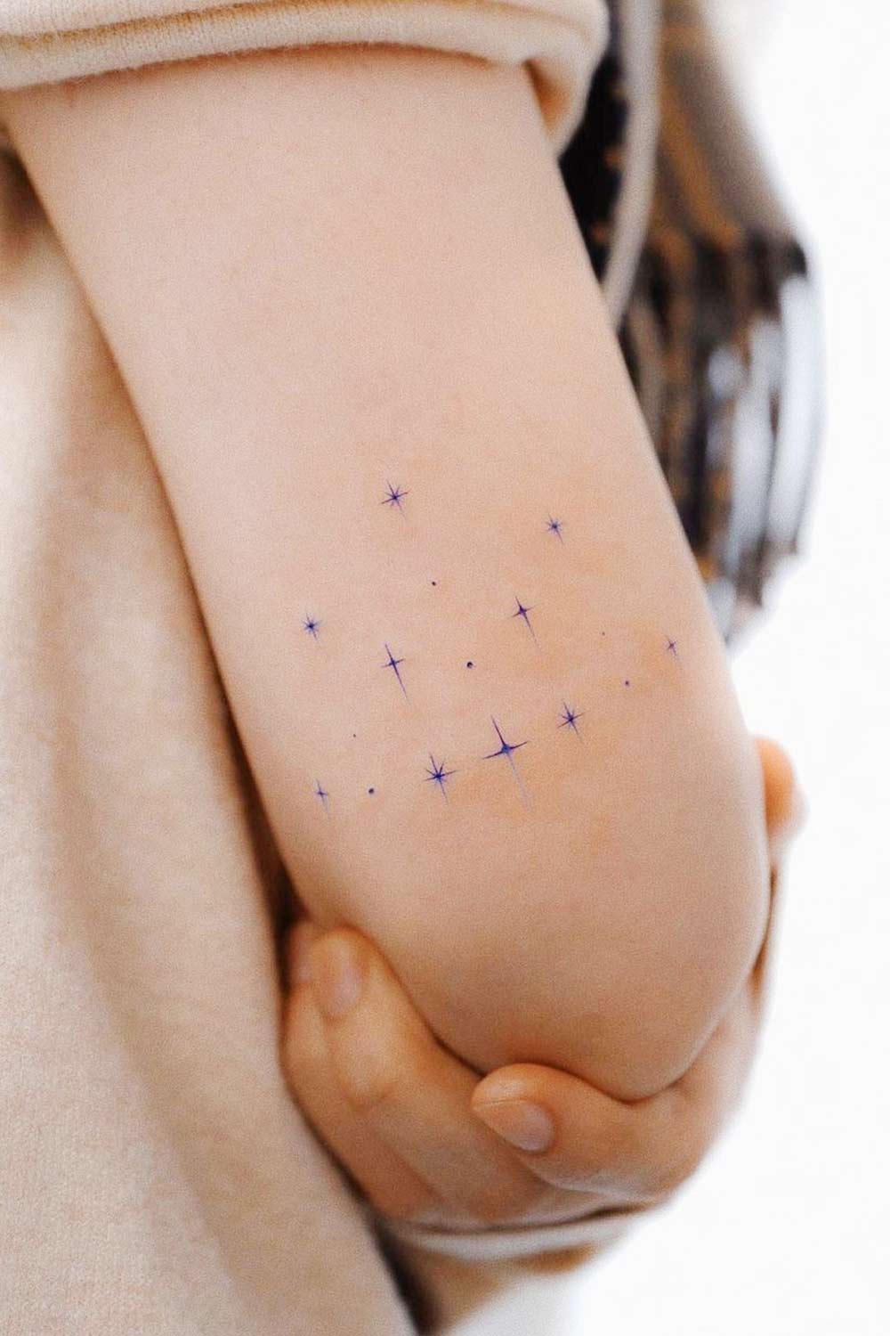 Minimalist Tattoo Design with Constellation Stars