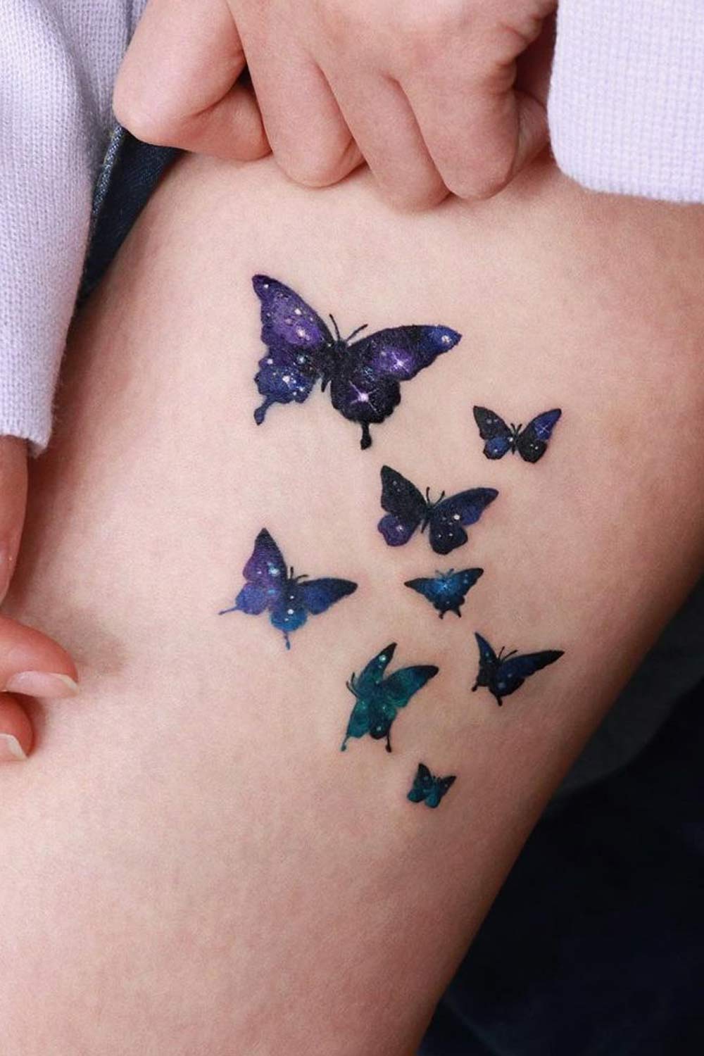 Thigh Tattoo with Galaxy Butterflies