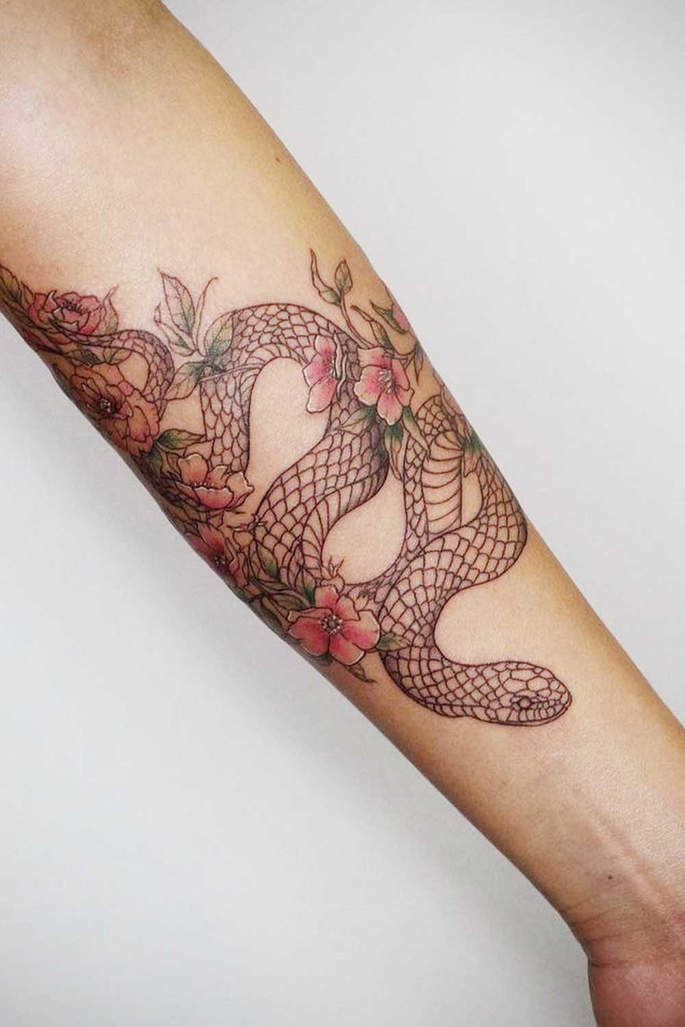 Arm Tattoo with Snake and Pink Flowers