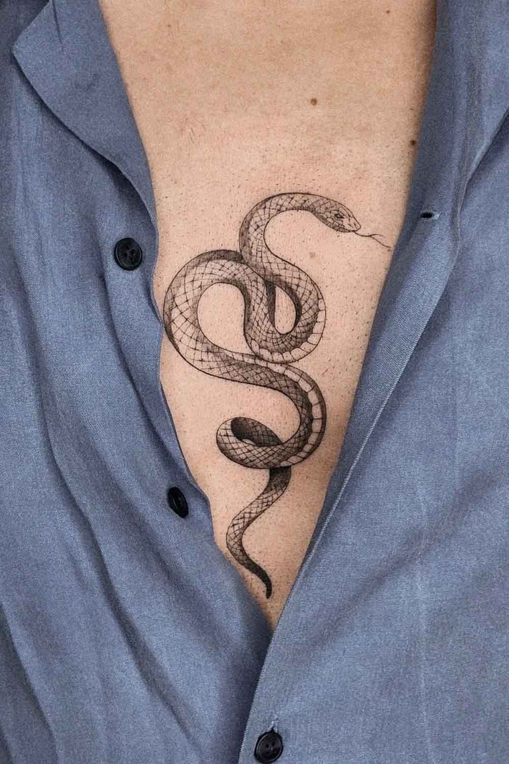 Minimalist Sternum Snake Tattoo