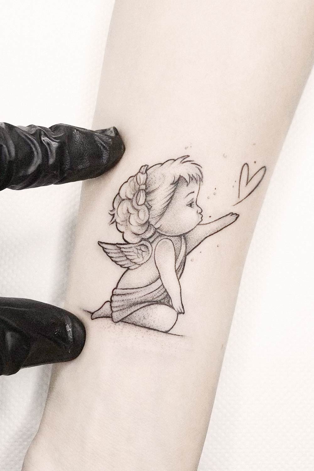 Small Baby Angel Sending Kiss Tattoo Design