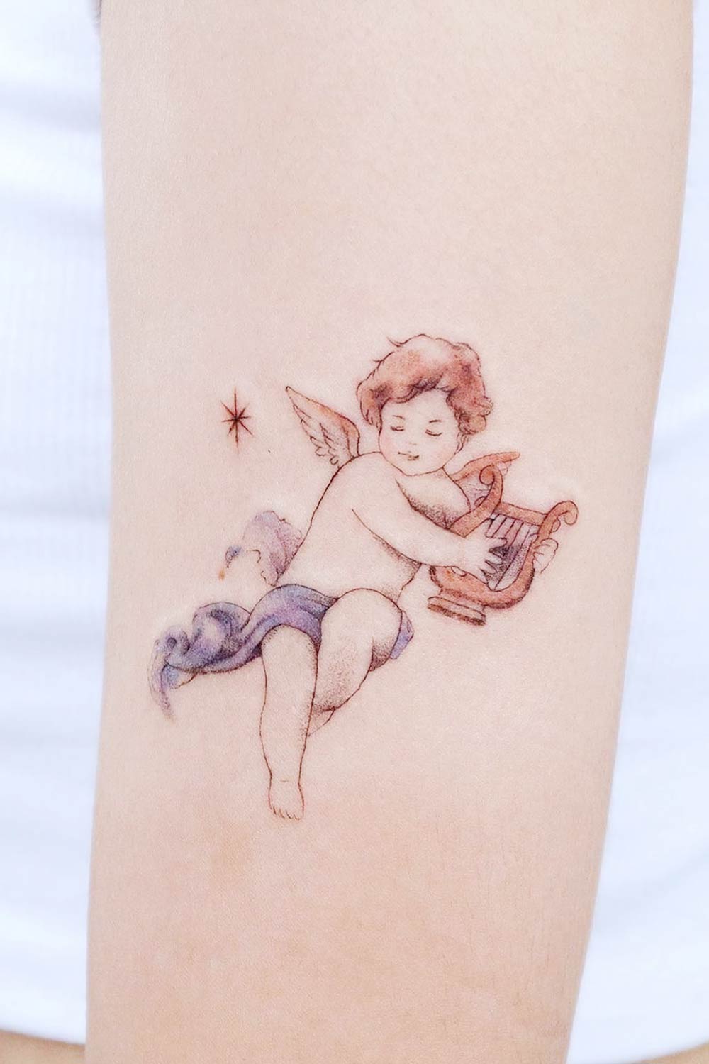 Baby Angel Playing Harp Tattoo Design
