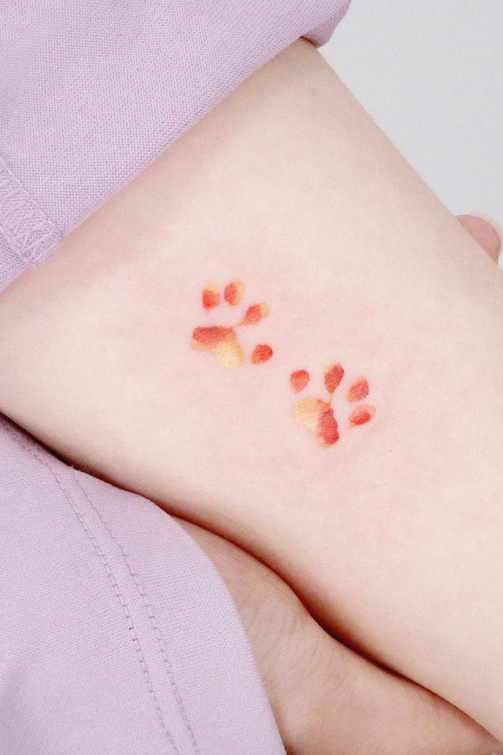 Small Minimalist Paws Tattoo