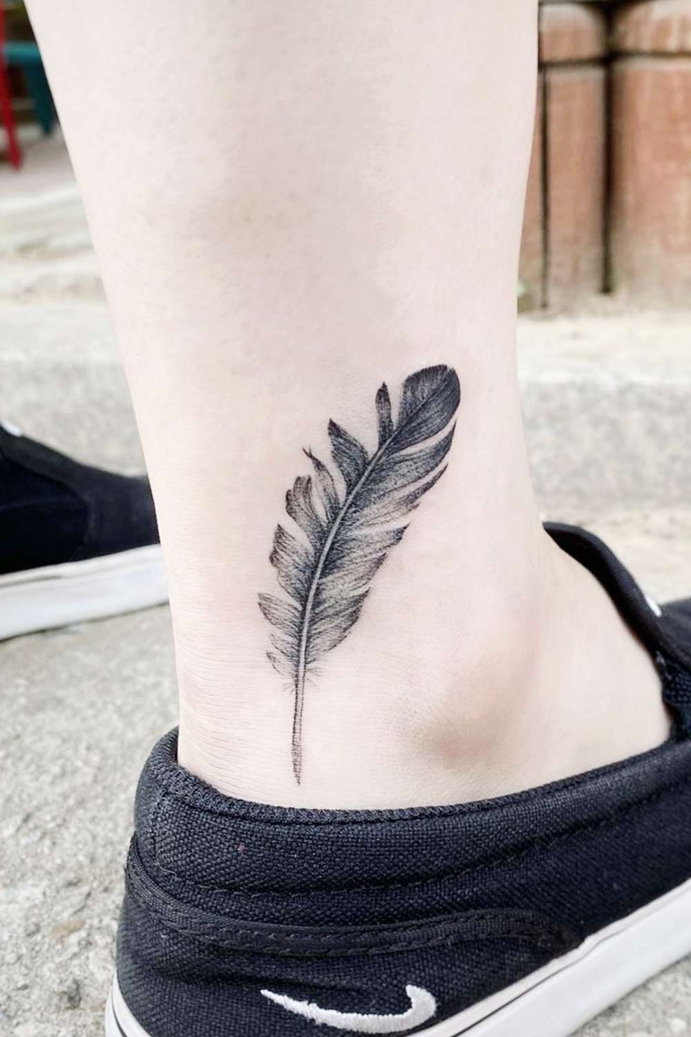Black Ankle Feather Tattoo