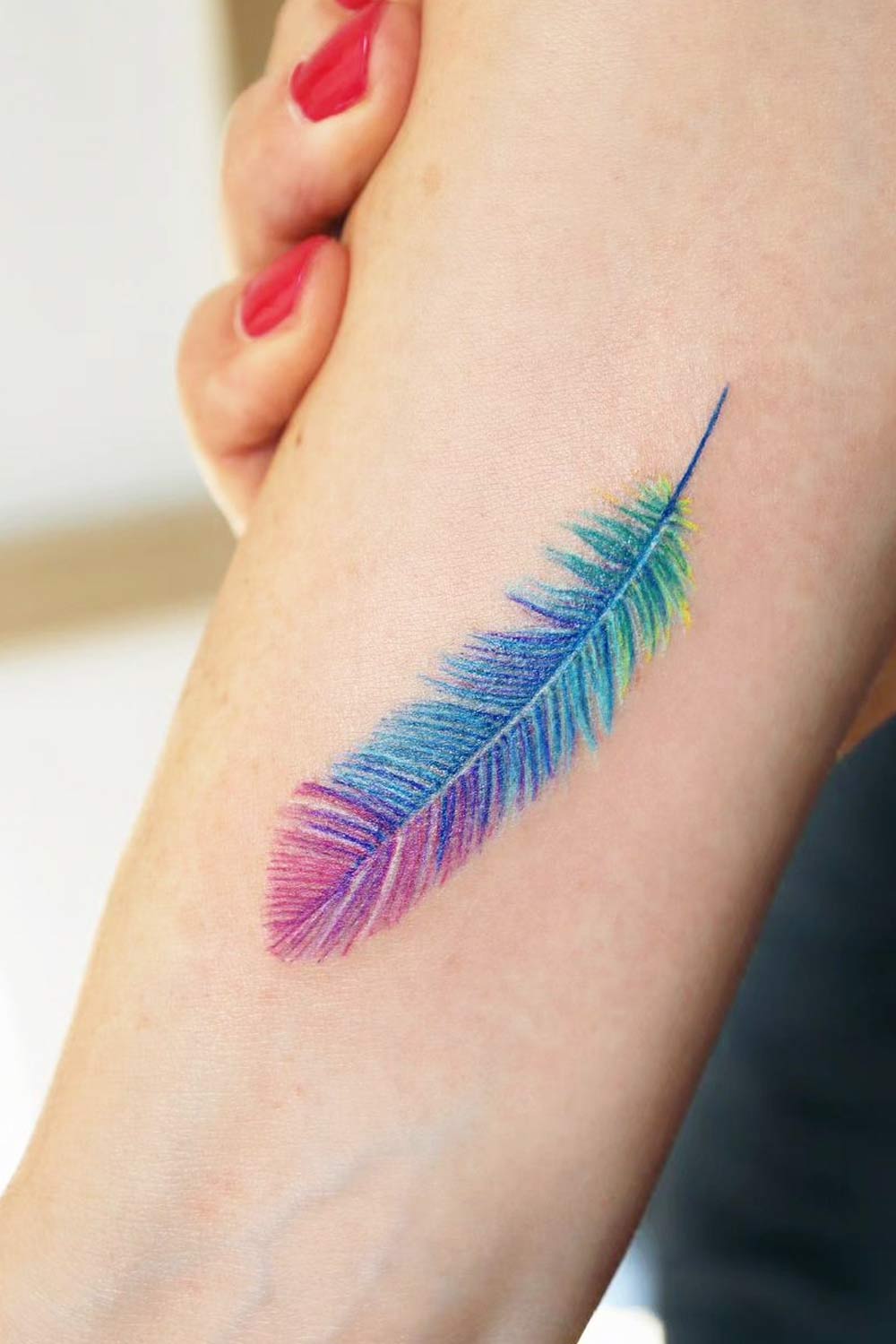 Little Tattoos — Little wrist tattoo of a feather.