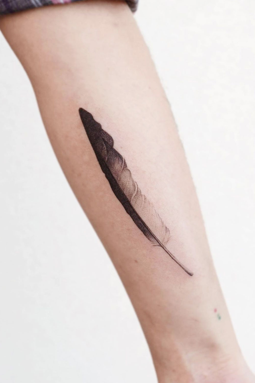 Peacock feather on the forearm | Feather tattoo black, Peacock tattoo,  Incredible tattoos