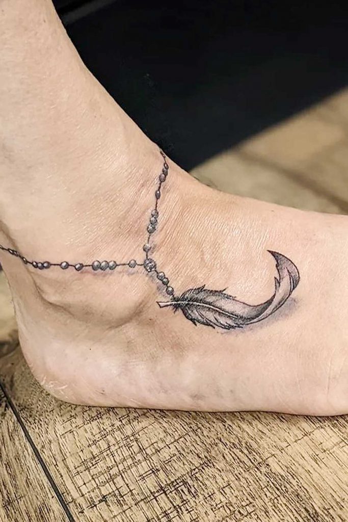 Feet Tattoo with Feather