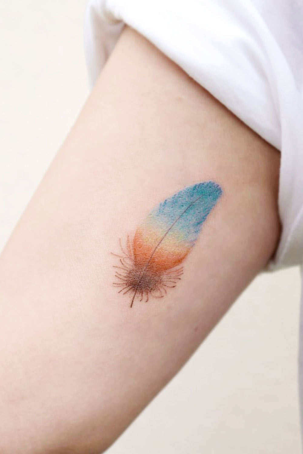Sky Colored Feather Tattoo