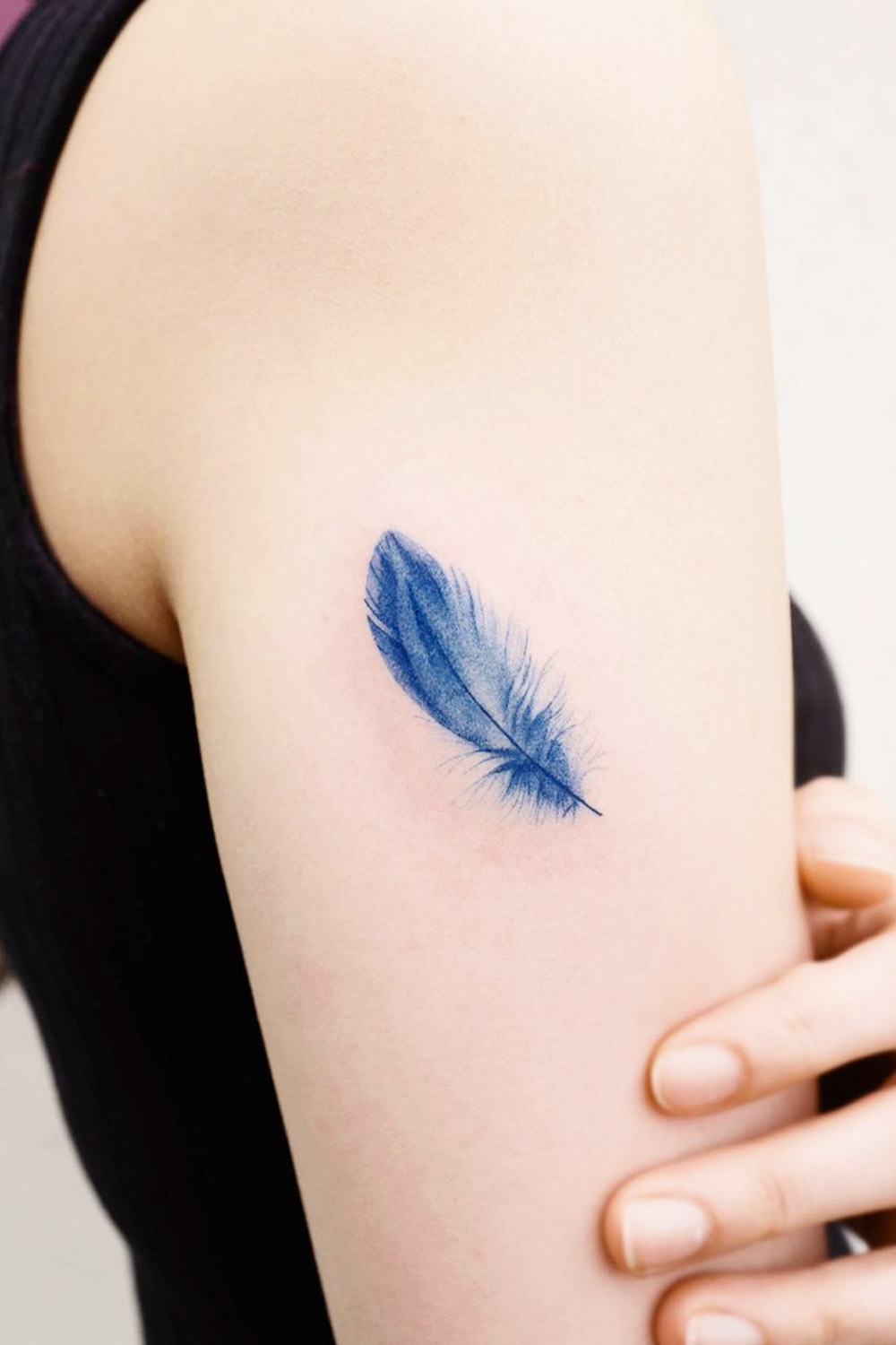 Blue Realistic Feather Tattoo