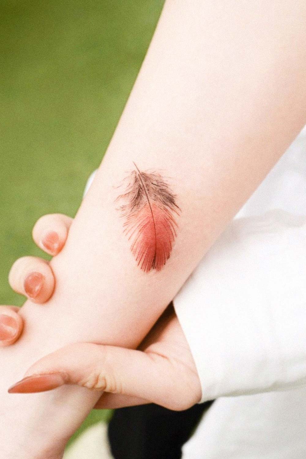 feather tattoo small arm watercolor realistic