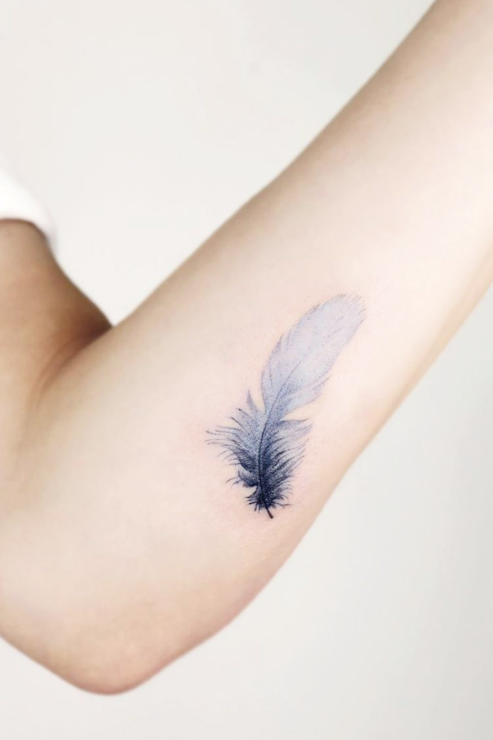 Blue Watercolor Small Feather Tattoo