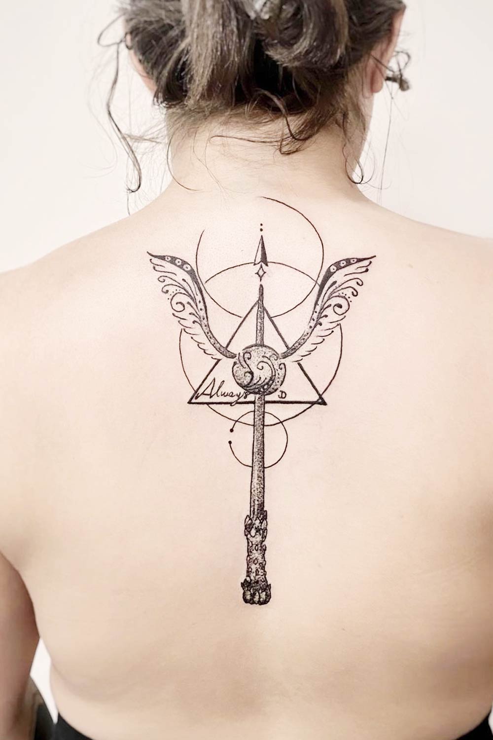 Back Tattoo with wand and Snitch