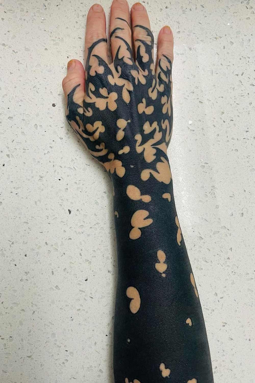 Blackout Sleeve and Hand Tattoo