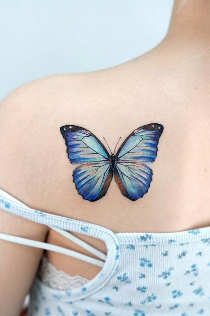 Blue Butterfly Tattoo on a Shoulder
