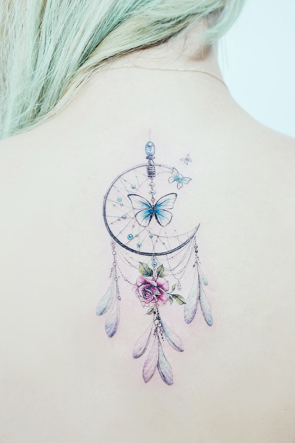 Dream Catcher with Butterfly in Center Tattoo Design