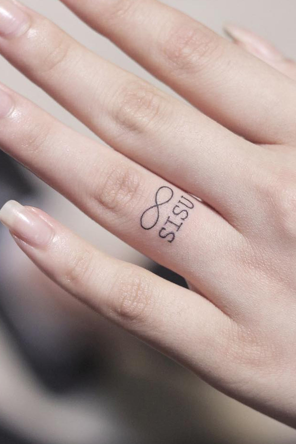 Eternity Symbol Finger Tattoo