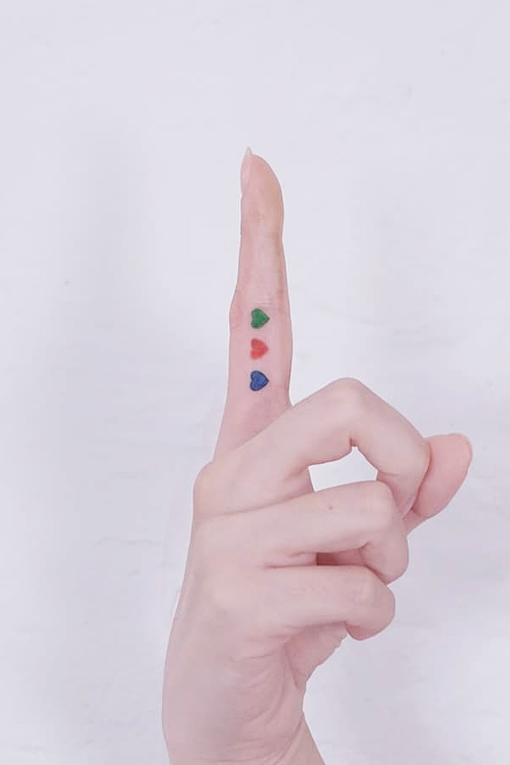 Colorful Hearts Finger Tattoo