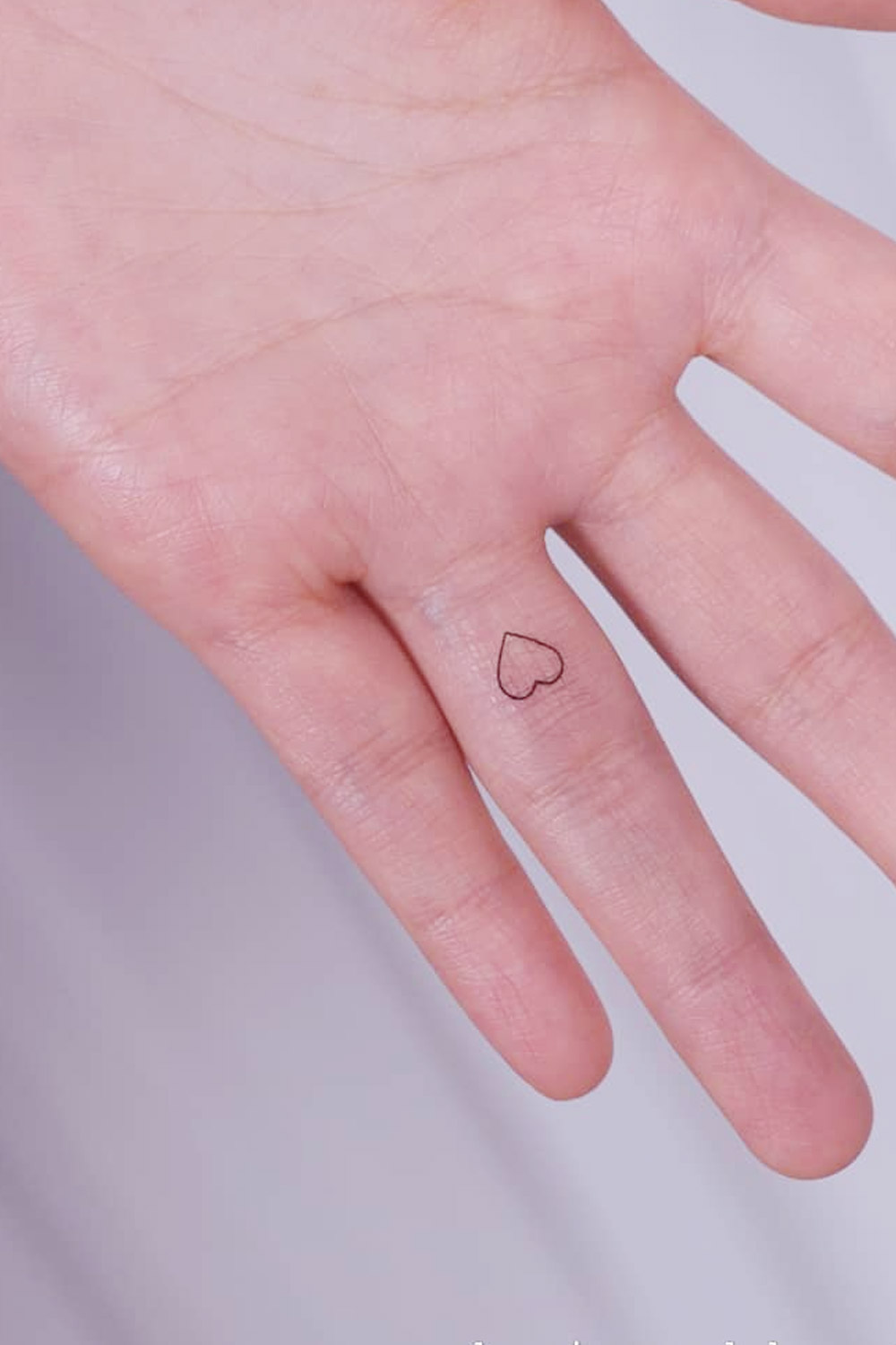 Minimalistic Finger Heart Tattoo