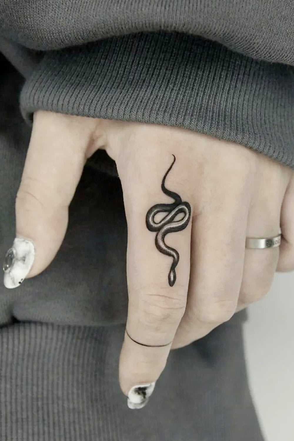 Black symbol tattoos on fingers - Tattoogrid.net