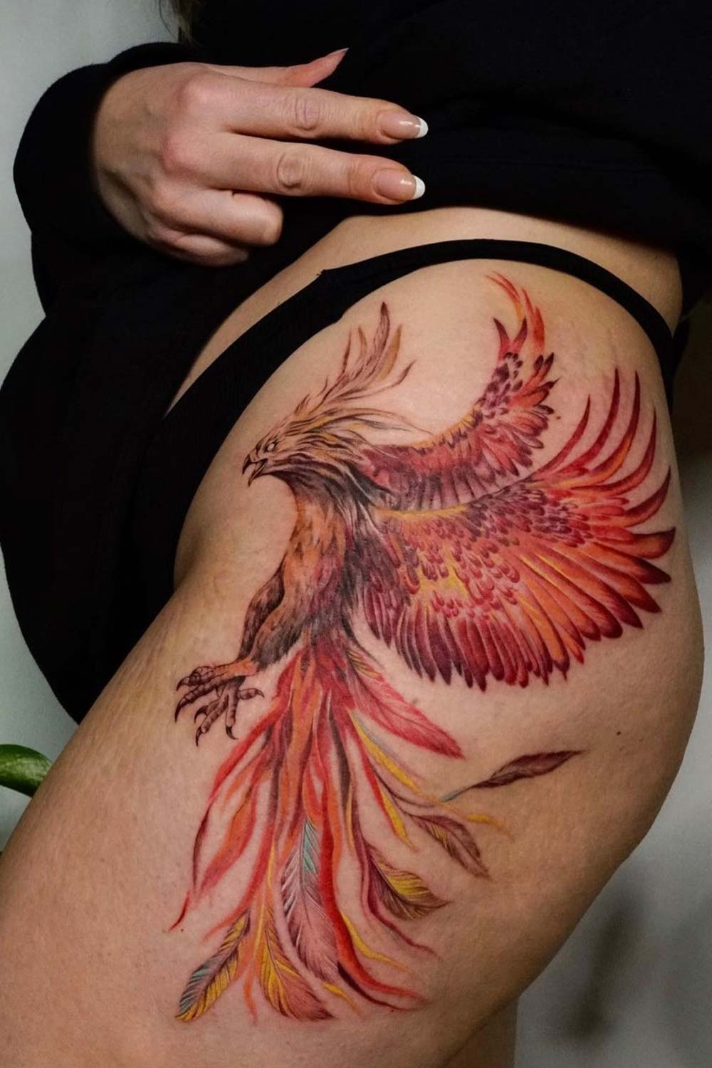 tattoo of a Phoenix rising from ashes in a galaxy on Craiyon