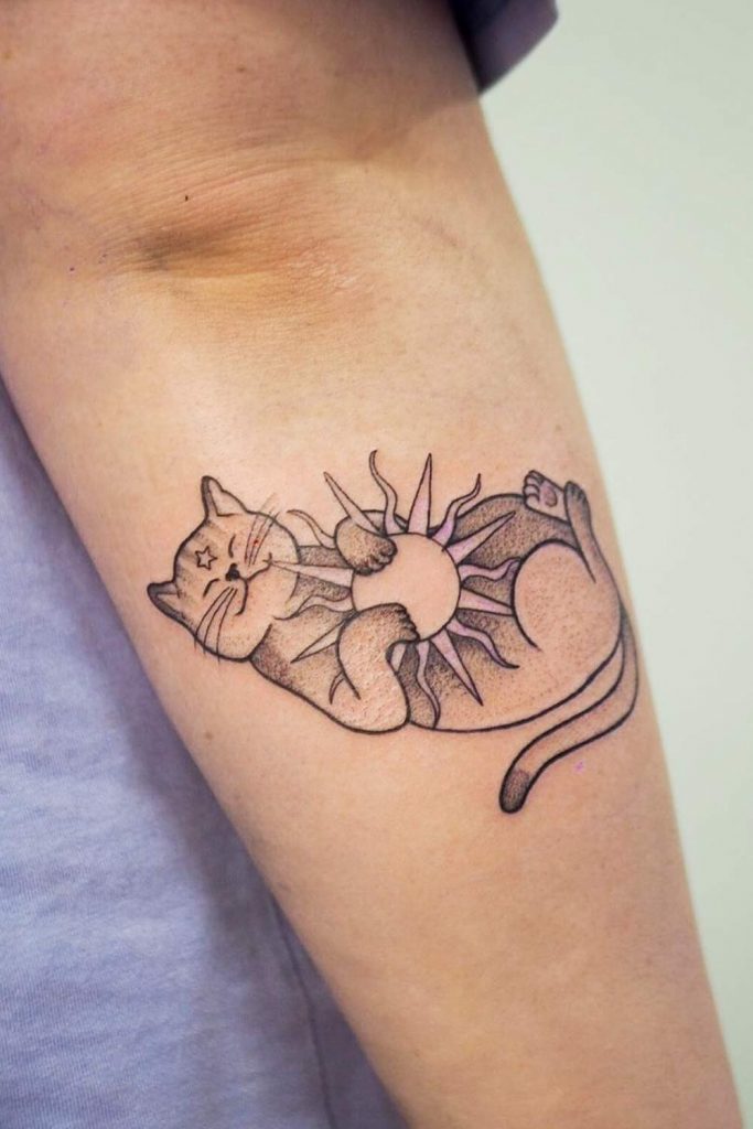 Cat Holding Sun Tattoo