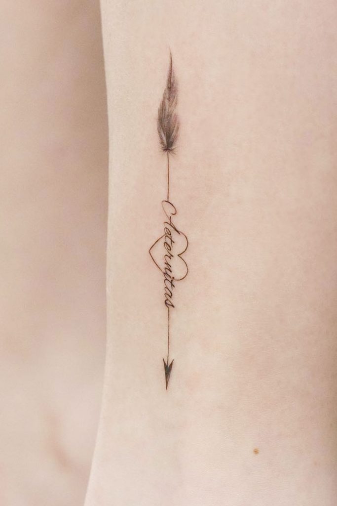 Love's Guidance: Heart-Adorned Arrow Tattoo