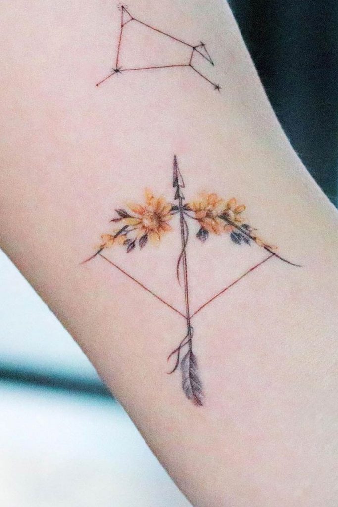 Bow and Arrow Tattoo with Blossoms