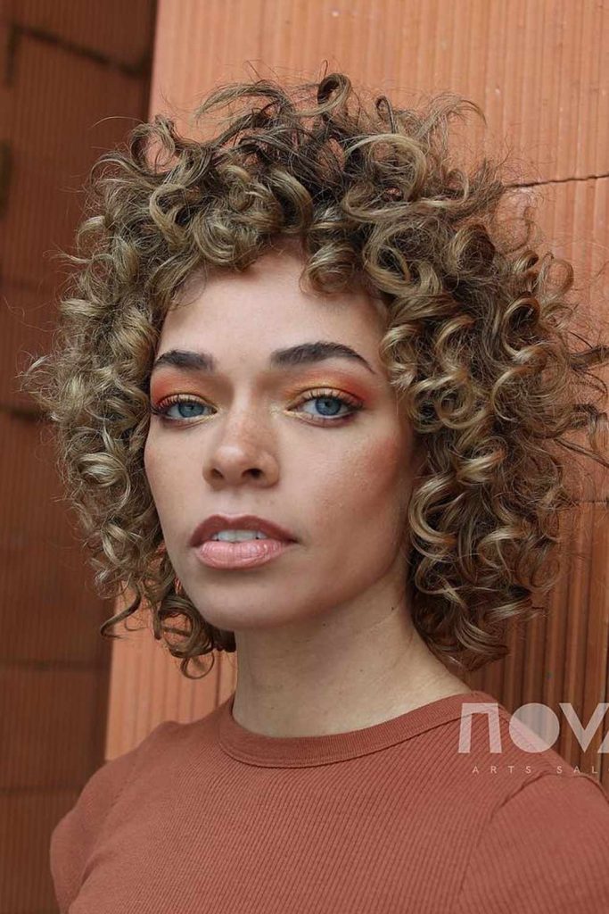 A Curly Shag with Sun-Kissed Tones