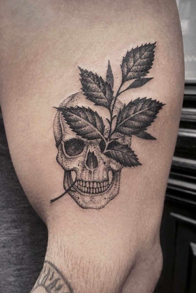 Minimalistic Leaves and Skull Tattoo