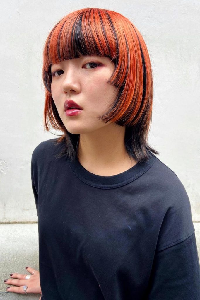 The top of the jellyfish haircut Korean is cut with more fluidity and softness with bangs similar to a bowl cut.