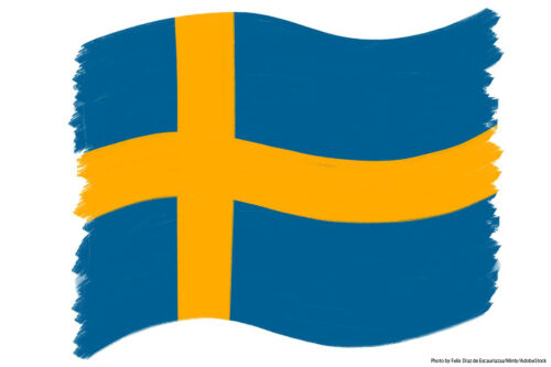 Which Scandinavian country’s flag is blue with a yellow cross?