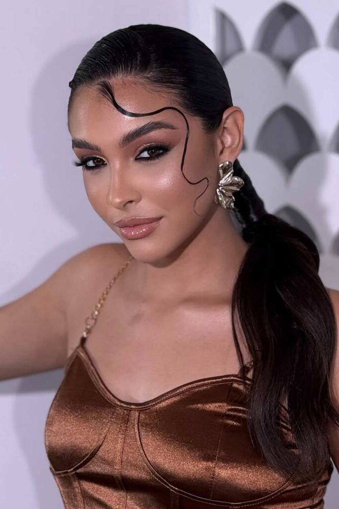 Sleek Ponytail with Artistic Baby Hairs