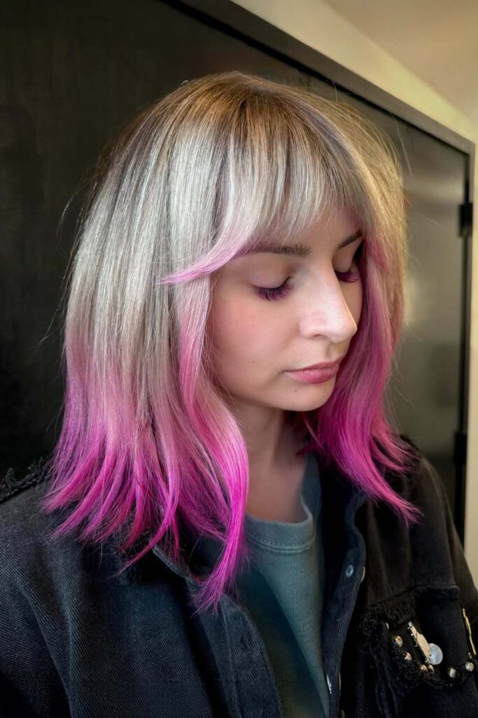 Blonde to Pink Ombre Hair with a Soft Fringe Accent