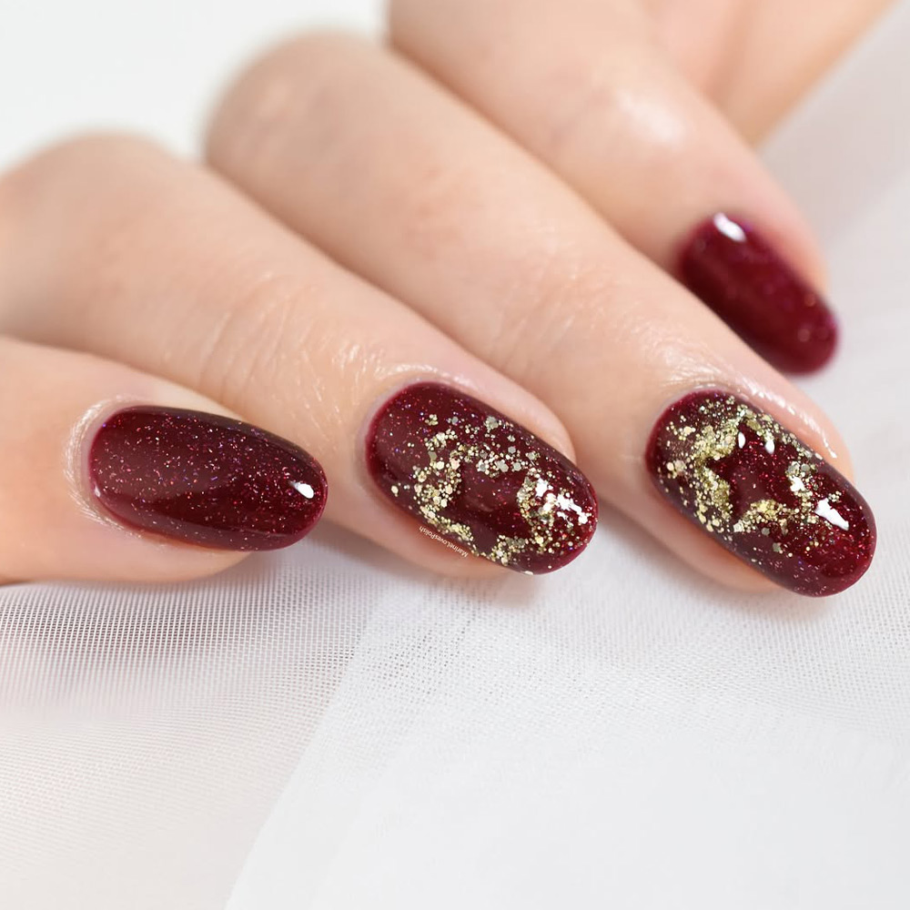 Burgundy Nails with Gold Glitter Accents