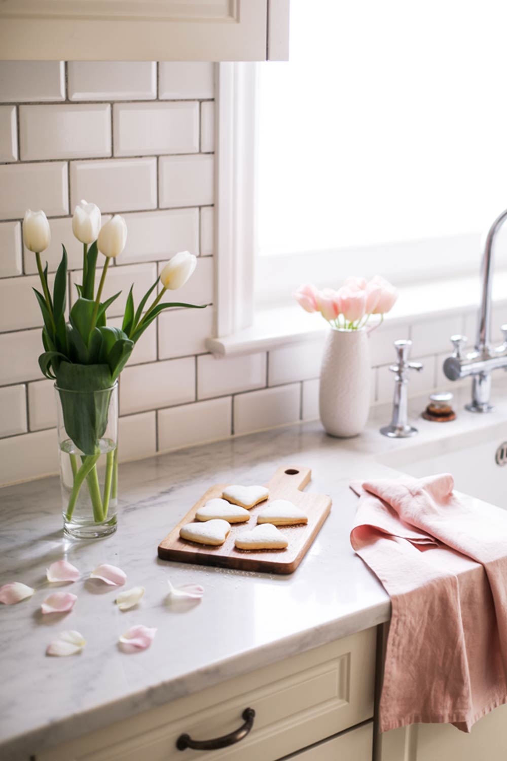 Simple Kitchen Decor With White Tulips, Heart Cookies, And Soft Pink Linen