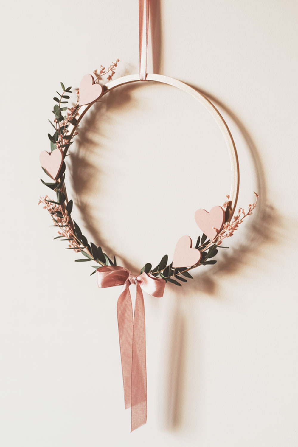 Minimalistic Hoop Wreath With Greenery, Hearts, And Pink Bow