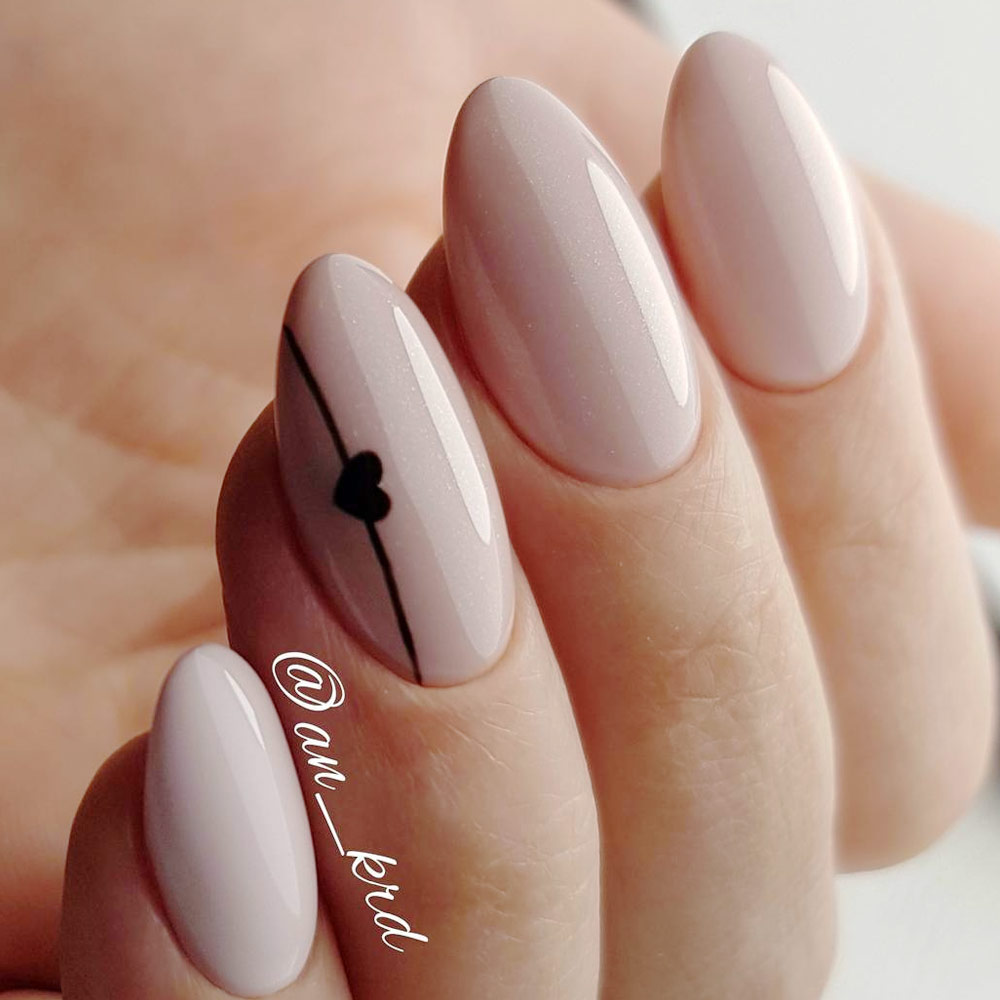 Soft Blush Nails with a Modern Heart Accent